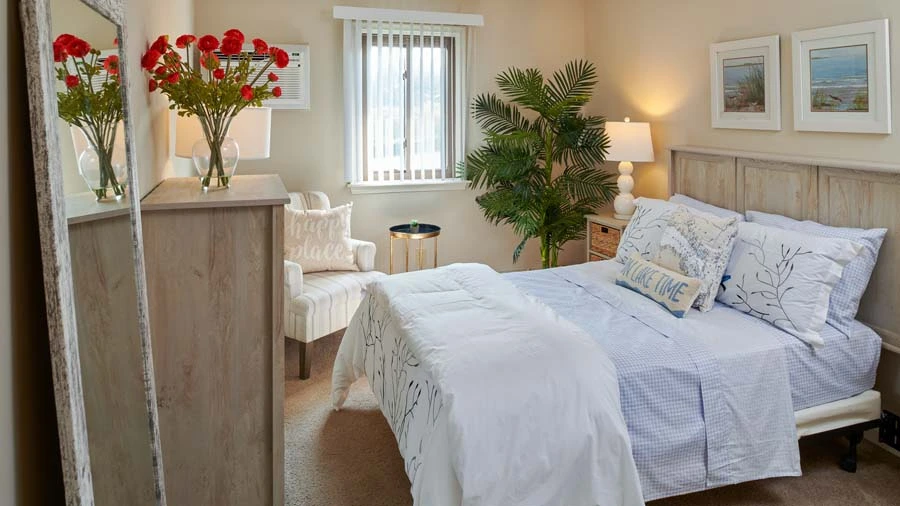 Bedroom of a senior apartment at American House East II, a senior living community in Roseville, Michigan